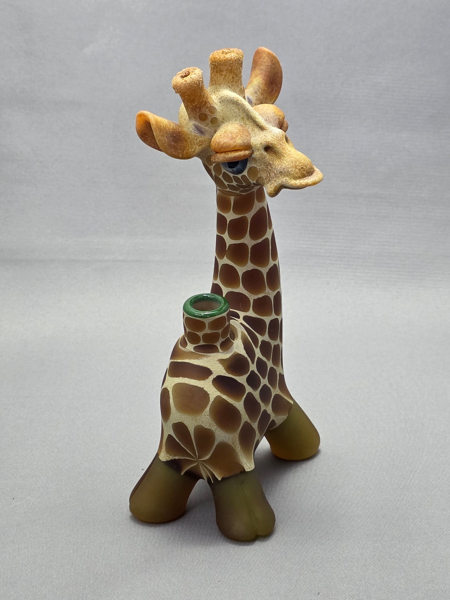 Robertson Glass Giraffe-shaped glass pipe on a light grey background