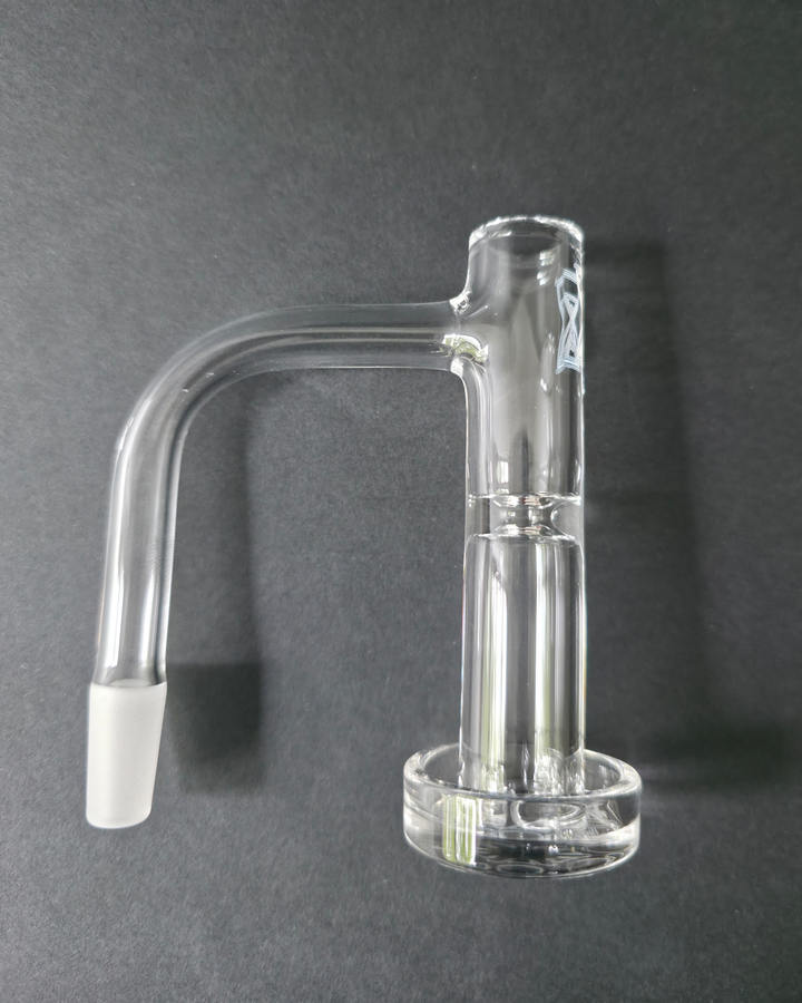 Clear glass quartz banger on a dark grey background