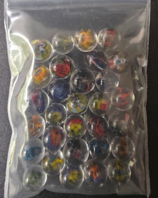 Collection of small pearls in clear plastic bag with a dark background