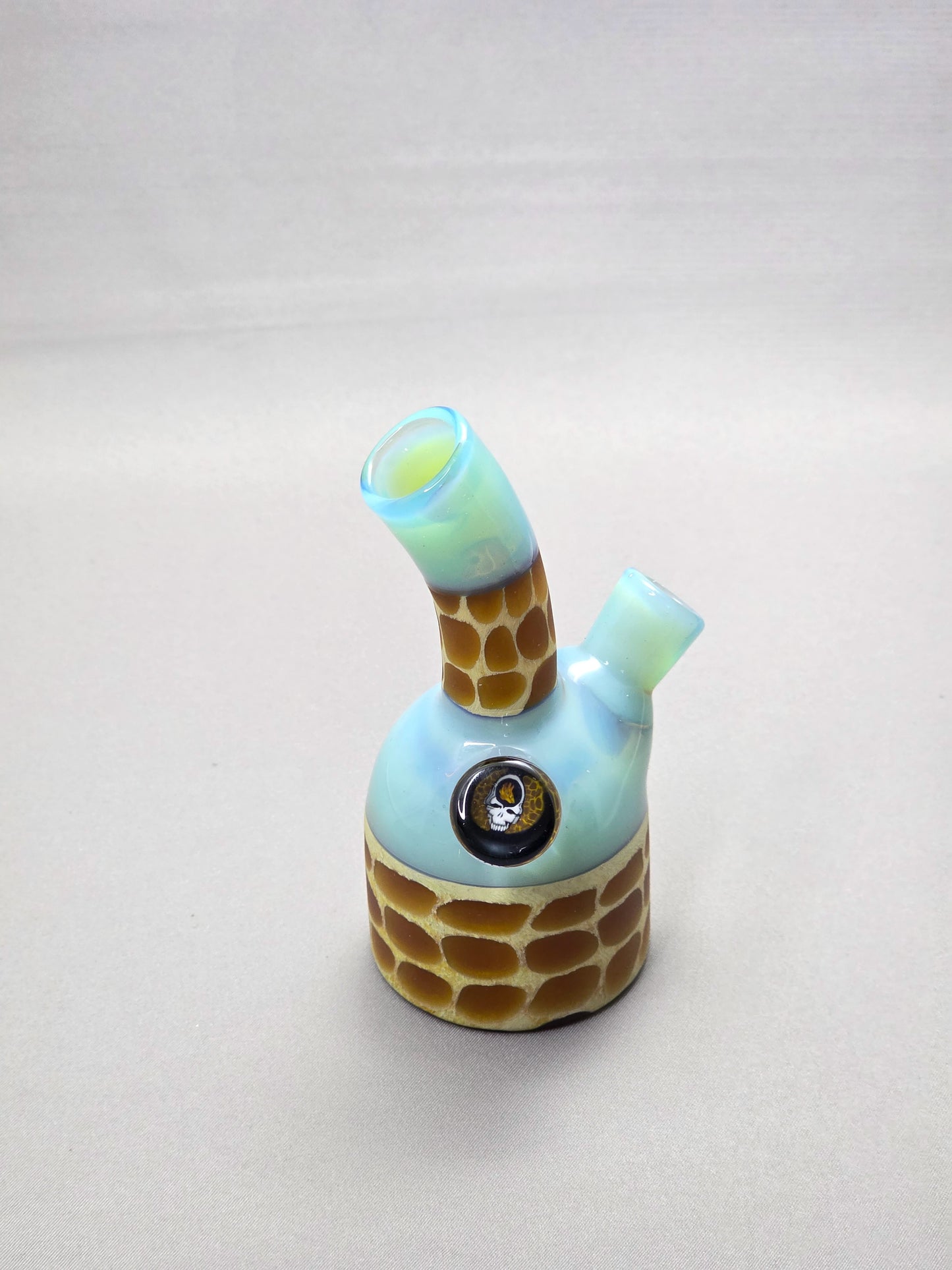 Robertson Glass blue giraffe pattern glass rig on a light grey background