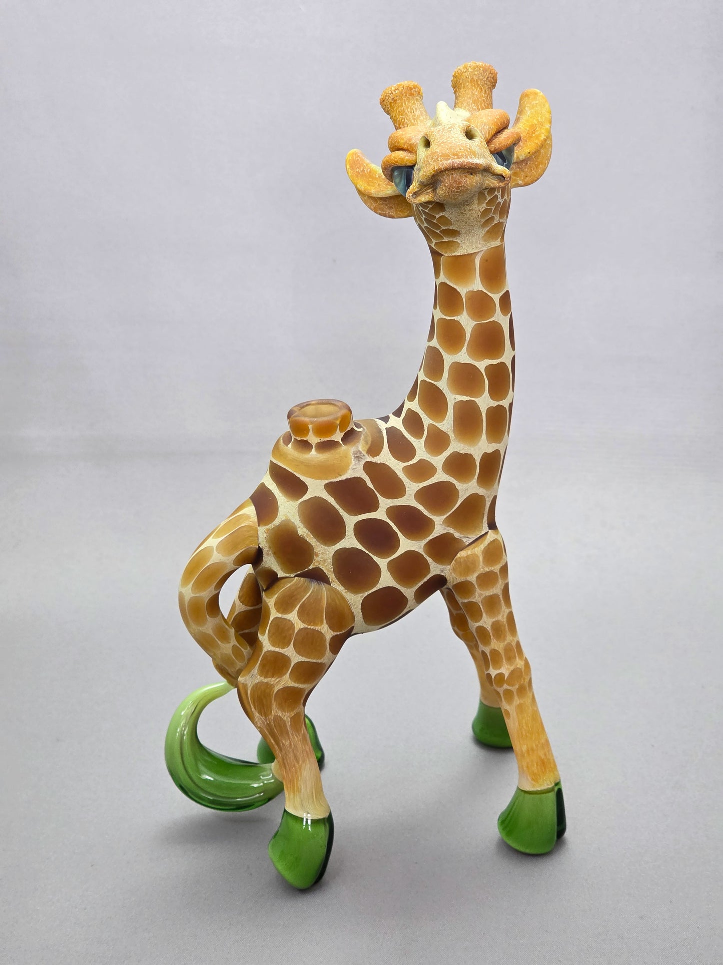 Robertson Glass Giraffe-shaped glass pipe on a light grey background