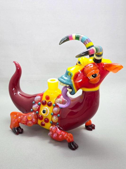 Robertson Glass Colourful glass Goat sculpture on a grey background