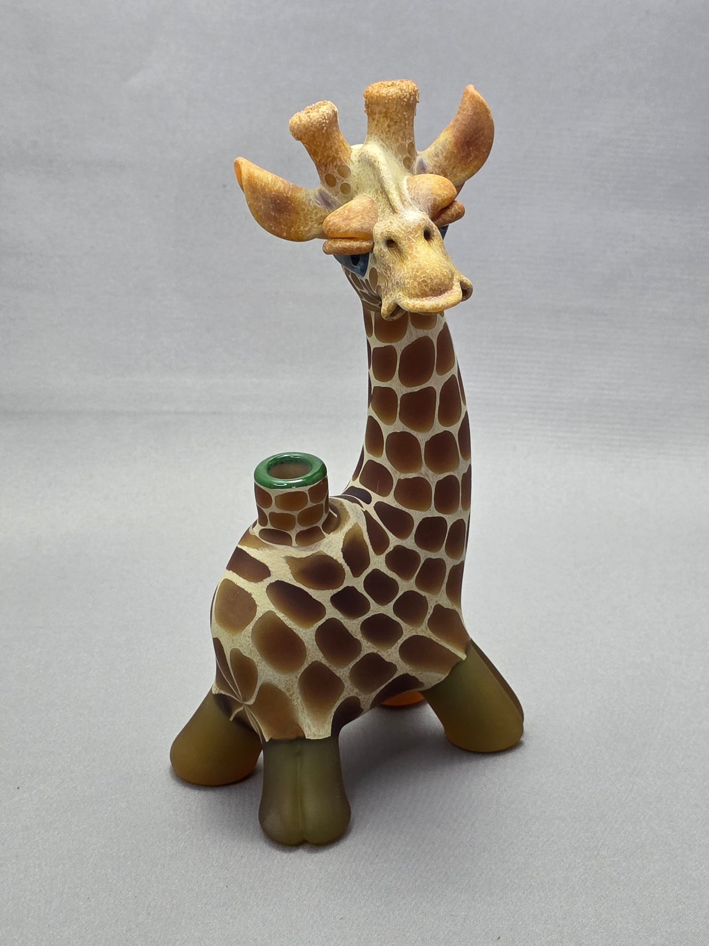 Robertson Glass Giraffe-shaped glass pipe on a light grey background