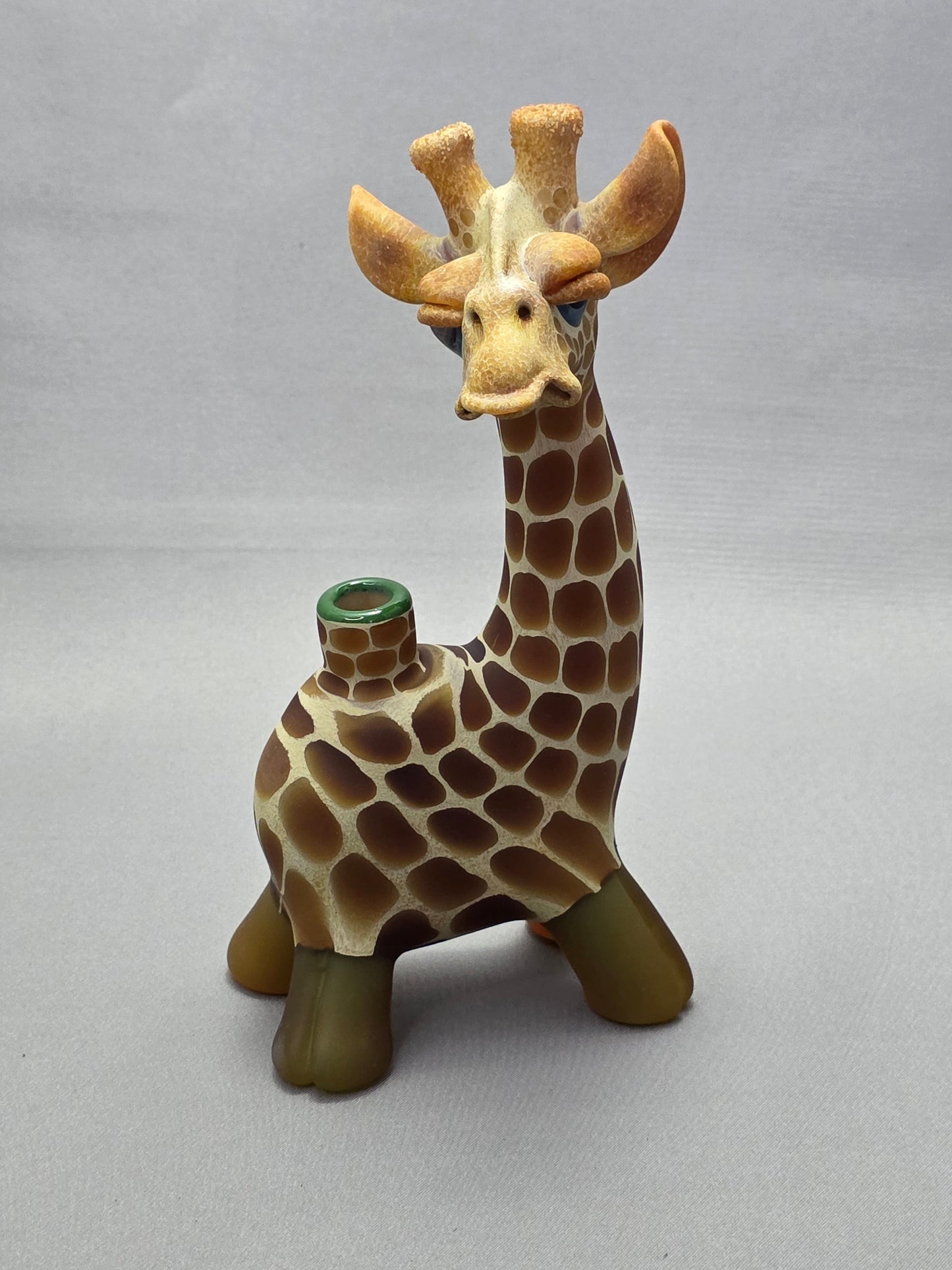 Robertson Glass Giraffe-shaped glass pipe on a light grey background
