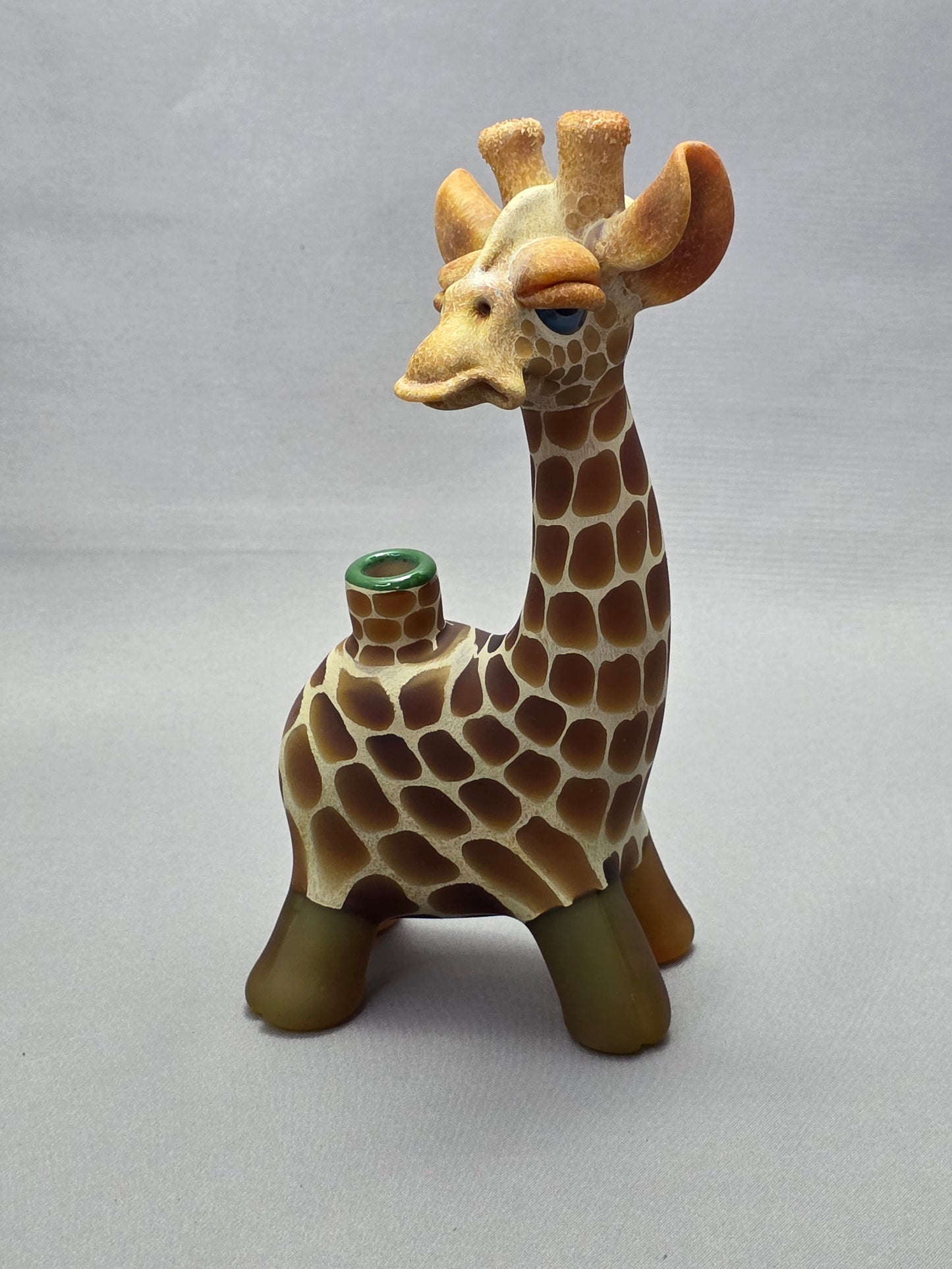 Robertson Glass Giraffe-shaped glass pipe on a light grey background