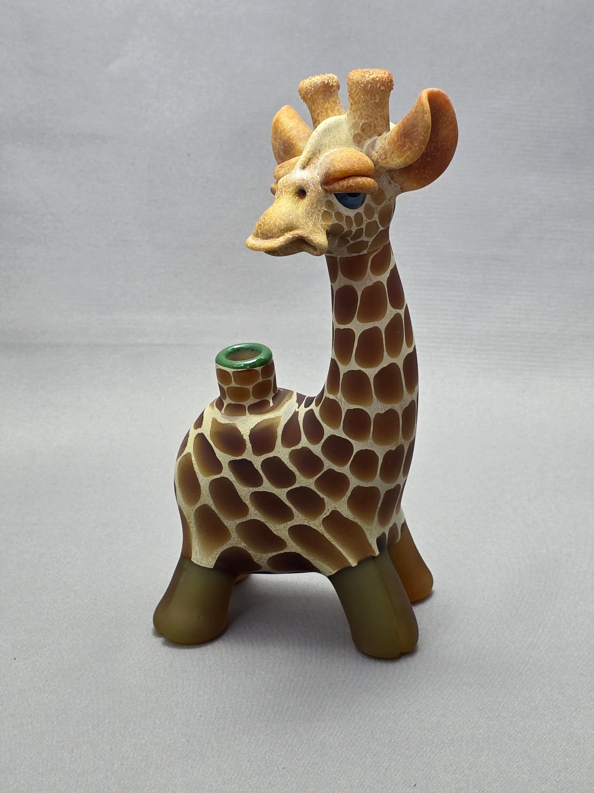 Robertson Glass Giraffe-shaped glass pipe on a light grey background