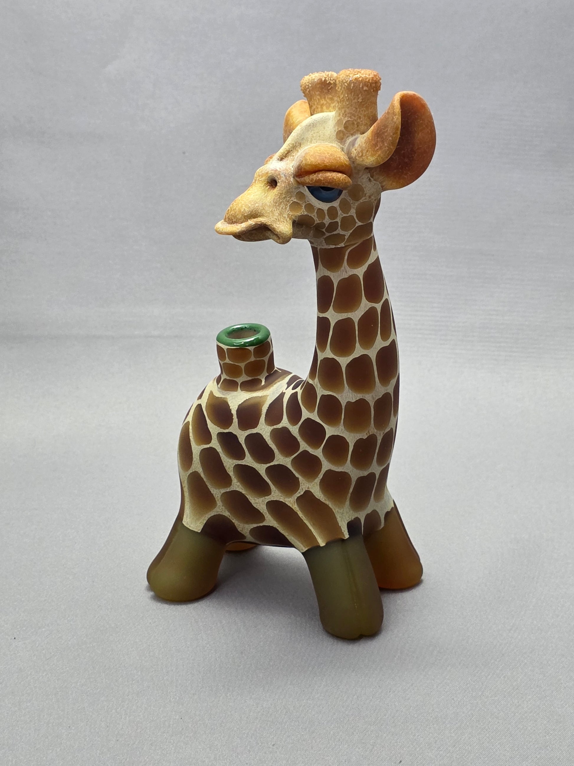 Robertson Glass Giraffe-shaped glass pipe on a light grey background