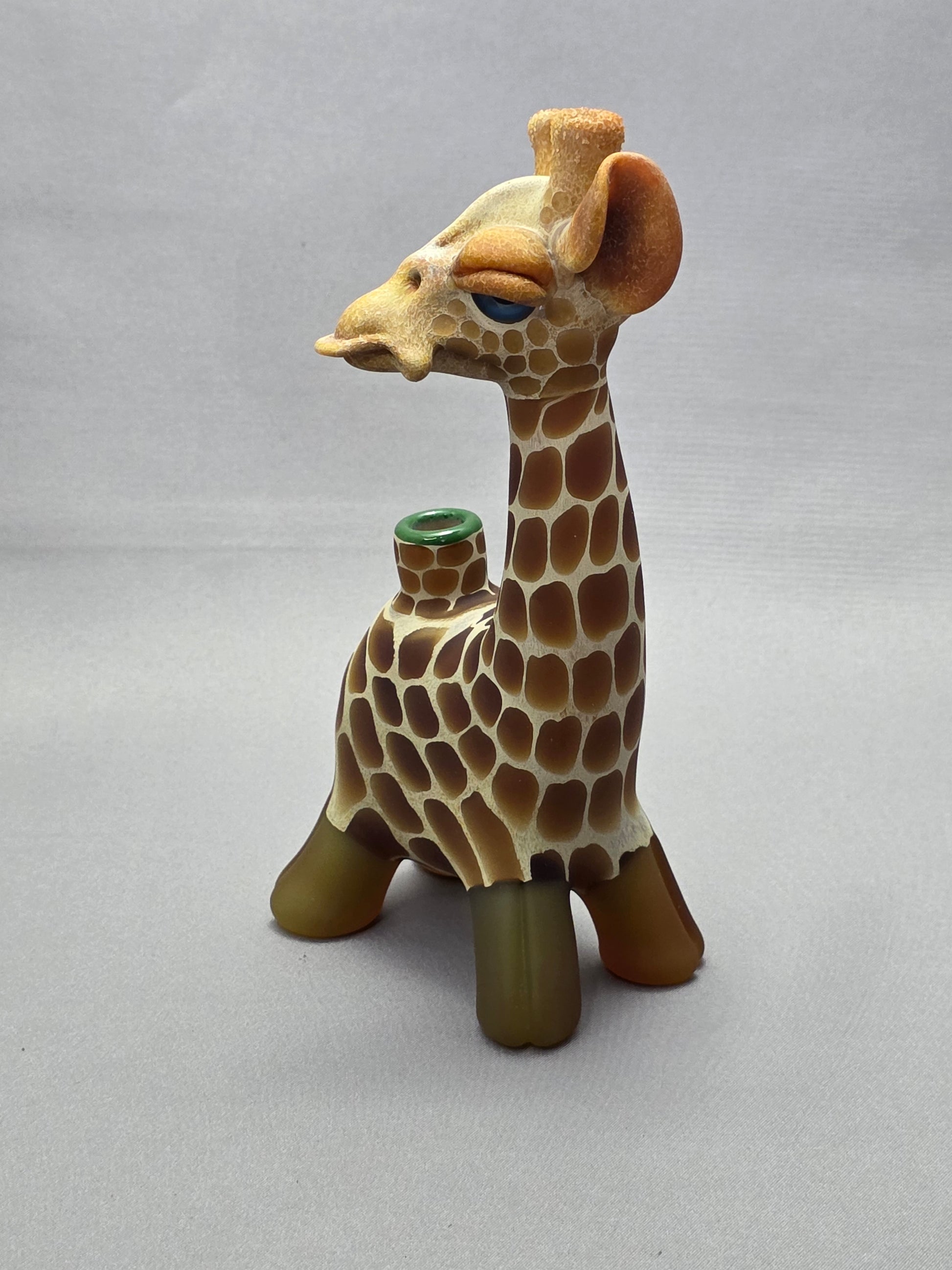 Robertson Glass Giraffe-shaped glass pipe on a light grey background