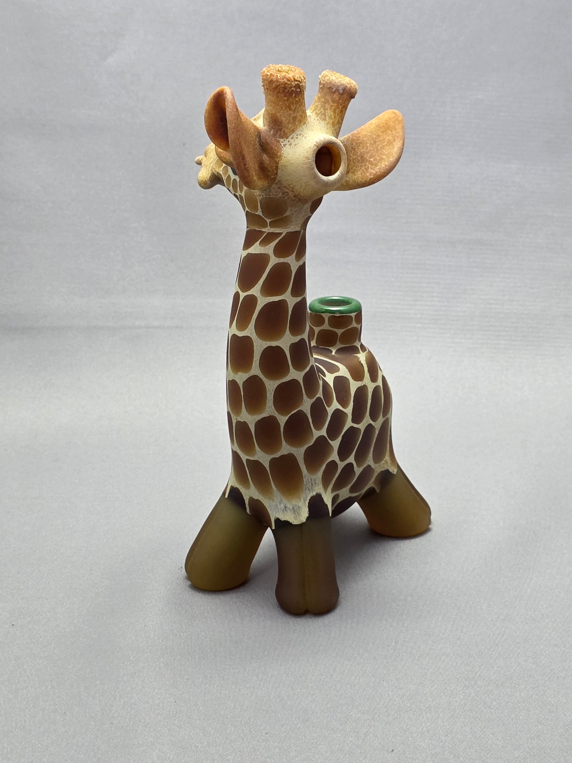 Robertson Glass Giraffe-shaped glass pipe on a light grey background