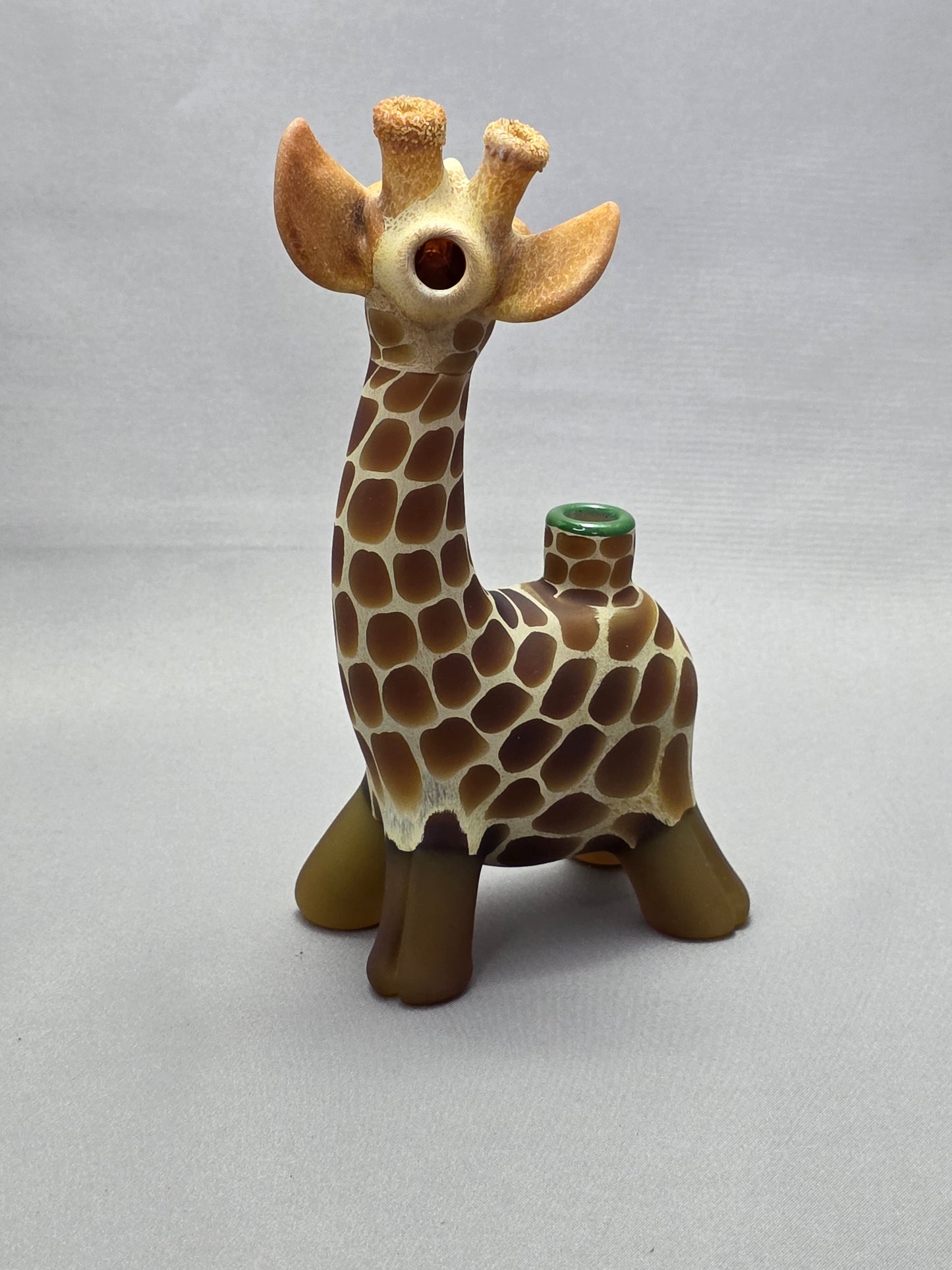 Robertson Glass Giraffe-shaped glass pipe on a light grey background