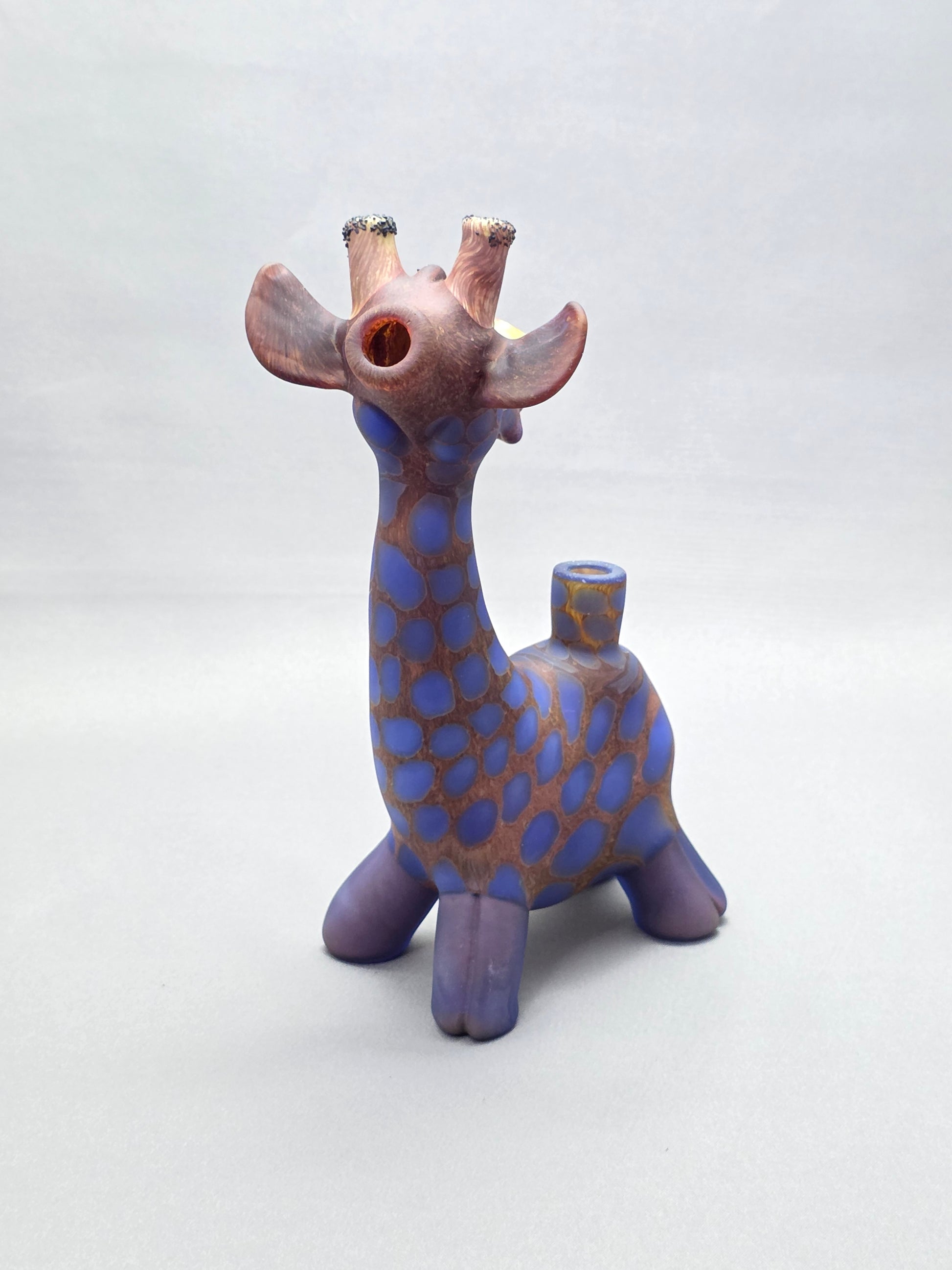Robertson Glass Giraffe-shaped glass pipe on a light grey background