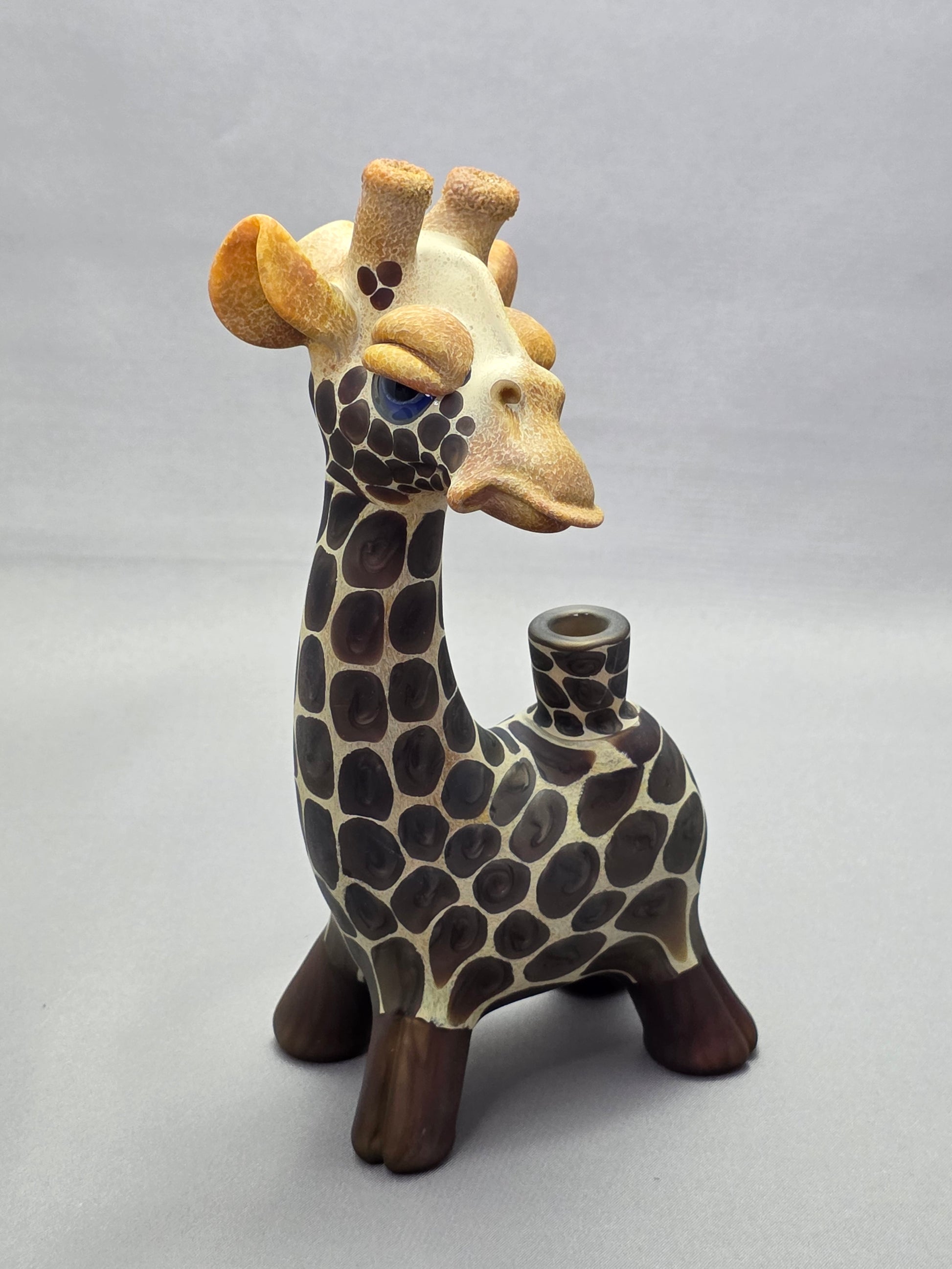 Robertson Glass Giraffe-shaped glass pipe on a light grey background