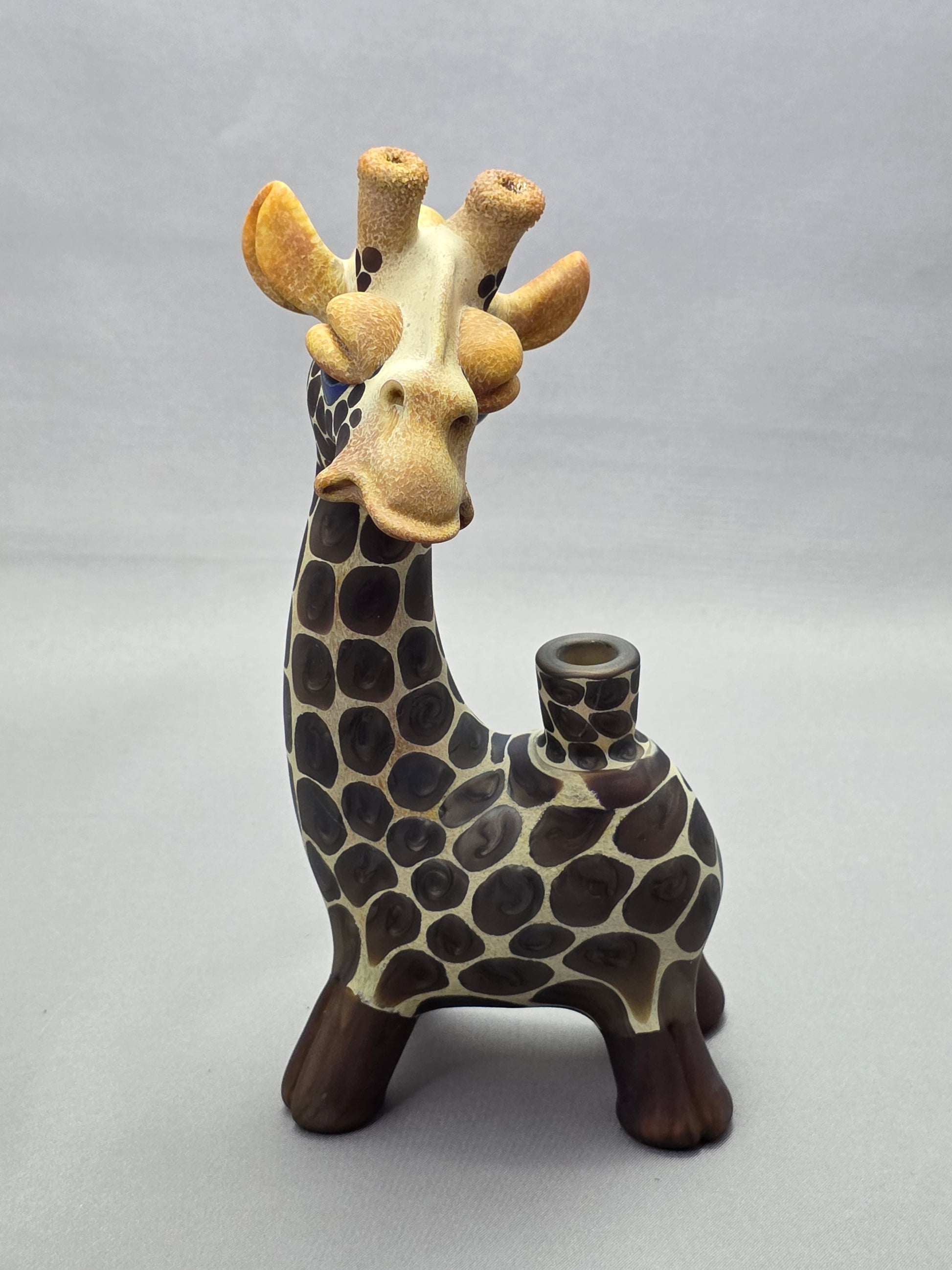 Robertson Glass Giraffe-shaped glass pipe on a light grey background