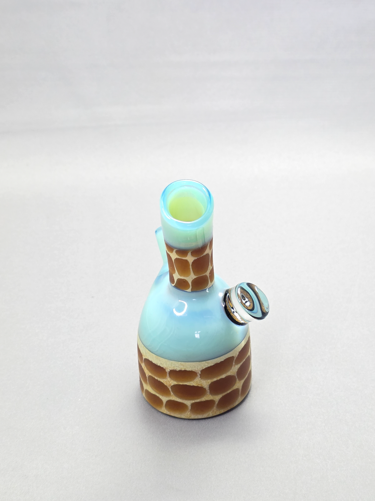 Robertson Glass blue giraffe pattern glass rig on a light grey background