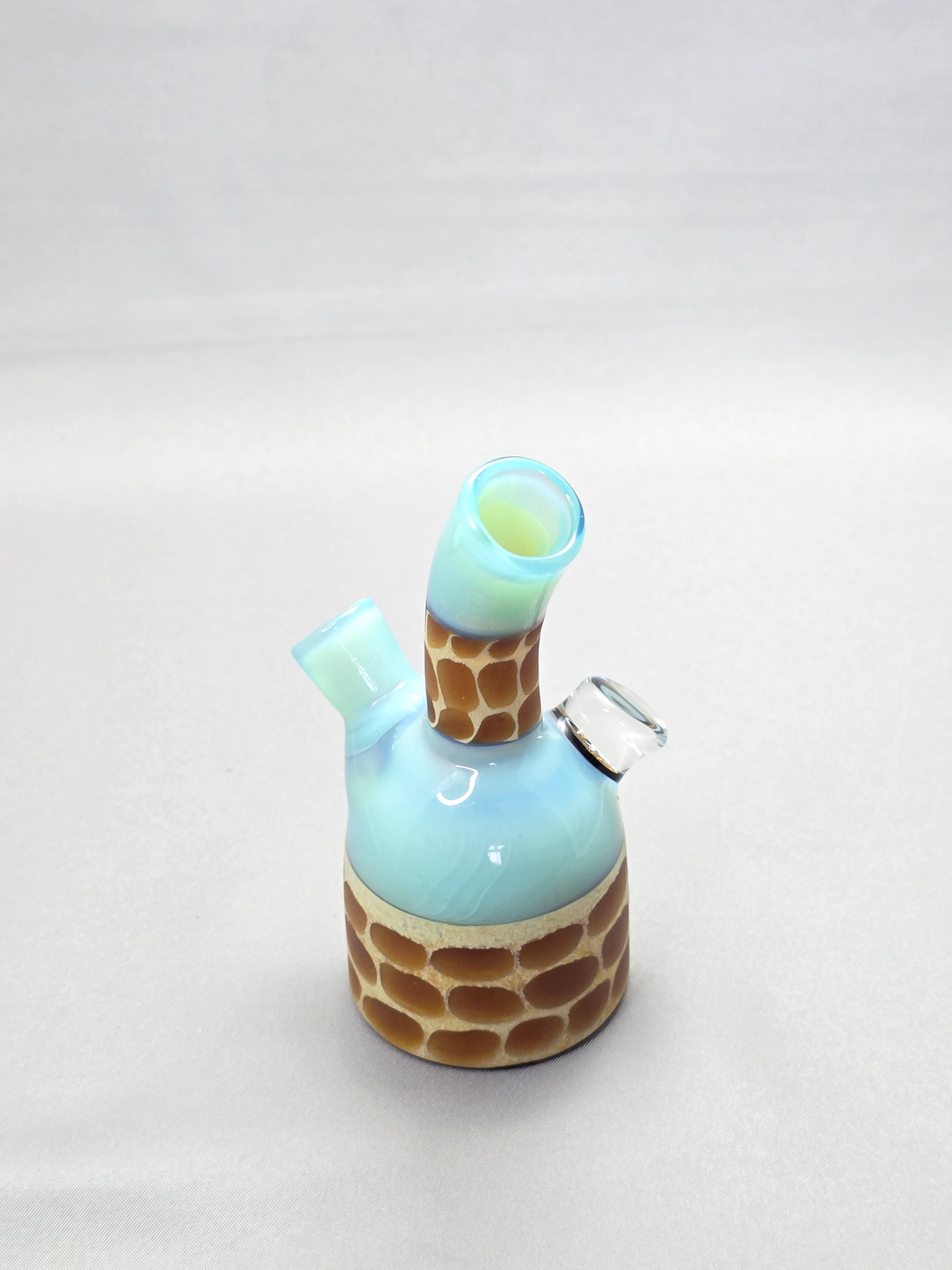 Robertson Glass blue giraffe pattern glass rig on a light grey background