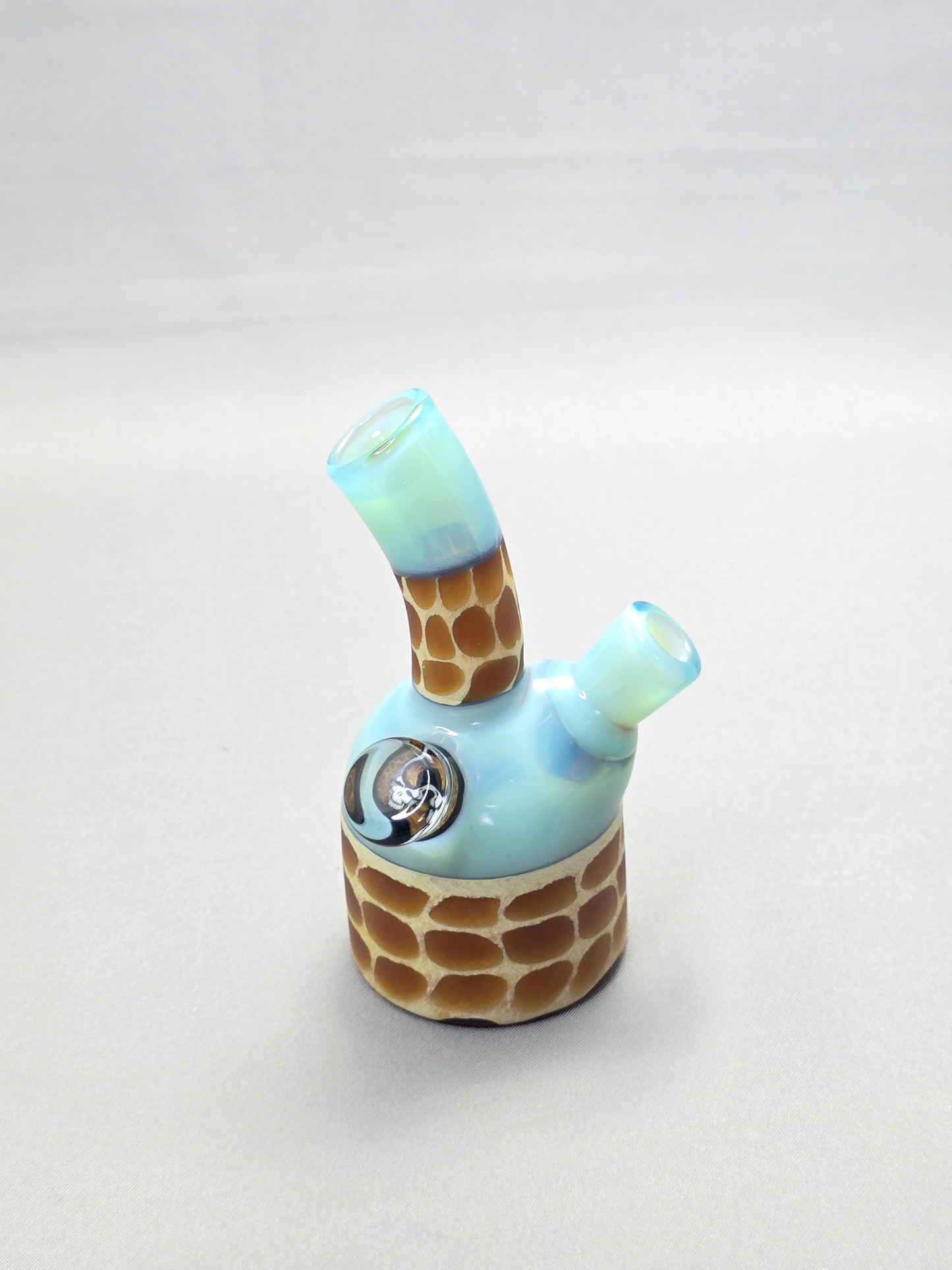 Robertson Glass blue giraffe pattern glass rig on a light grey background
