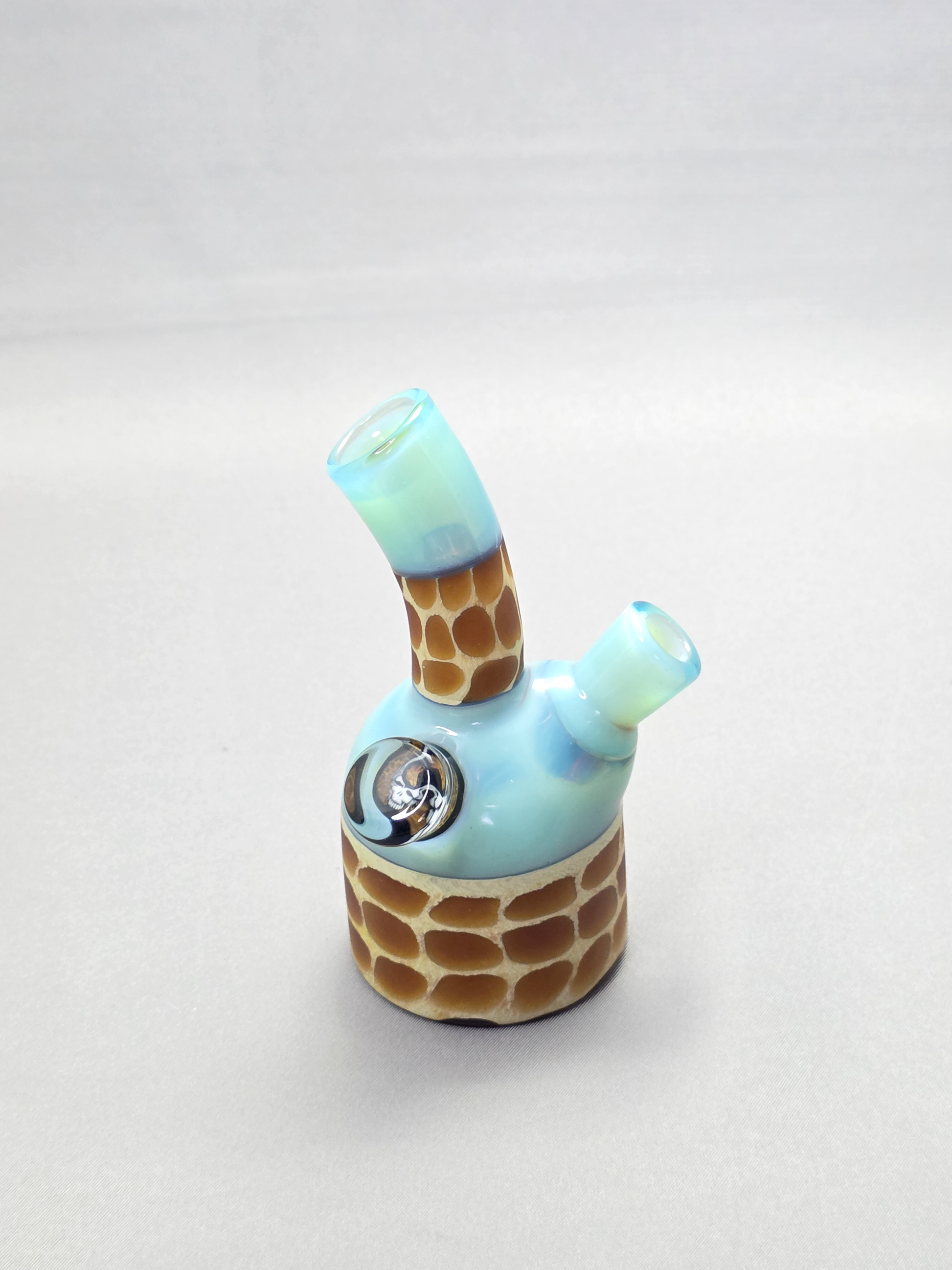Robertson Glass blue giraffe pattern glass rig on a light grey background