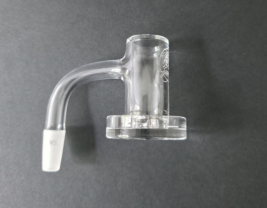 Clear glass quartz banger on a dark grey background