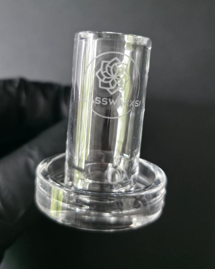 Clear glass quartz banger on a dark grey background