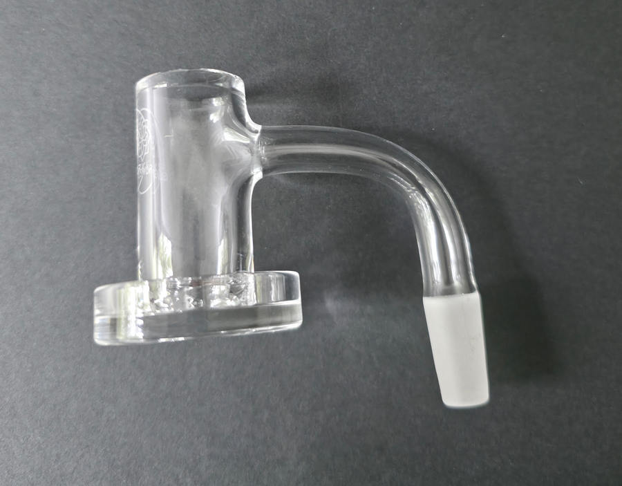 Clear glass quartz banger on a dark grey background