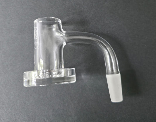 Clear glass quartz banger on a dark grey background