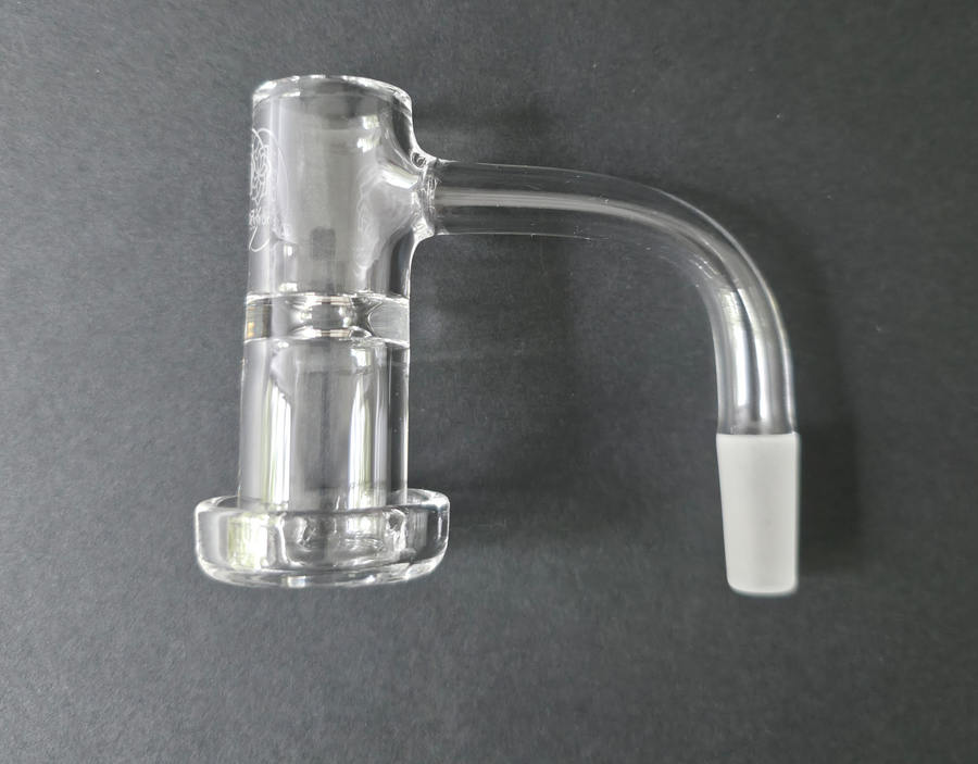Clear glass quartz banger on a dark grey background