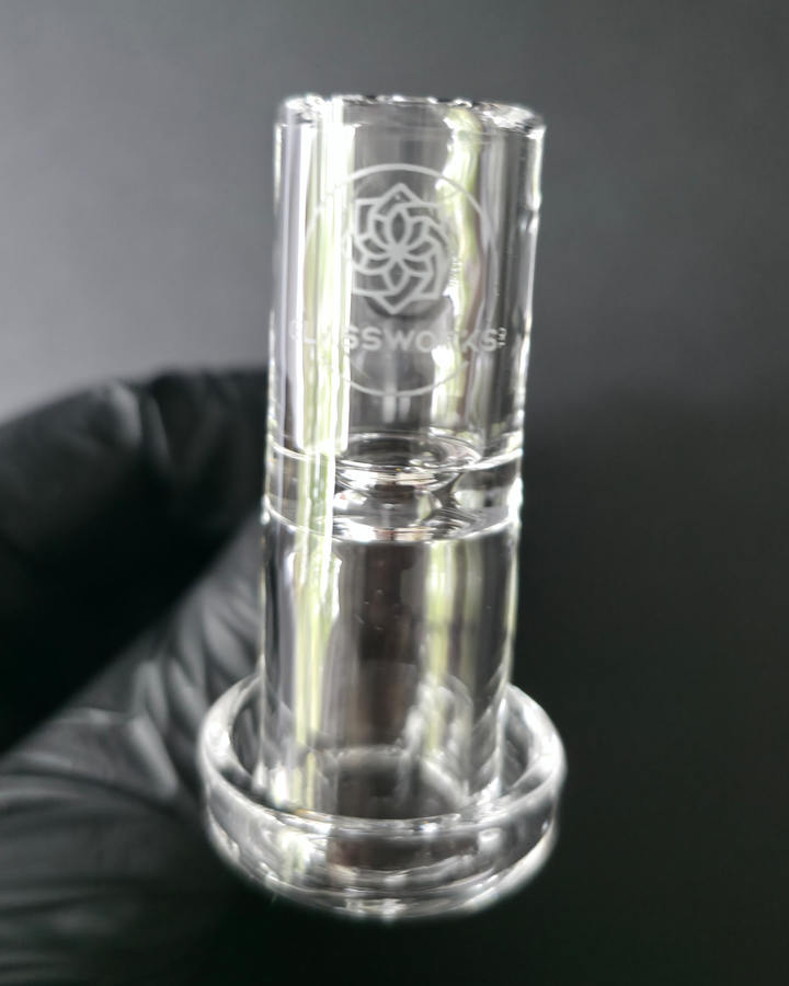 Clear glass quartz banger on a dark grey background