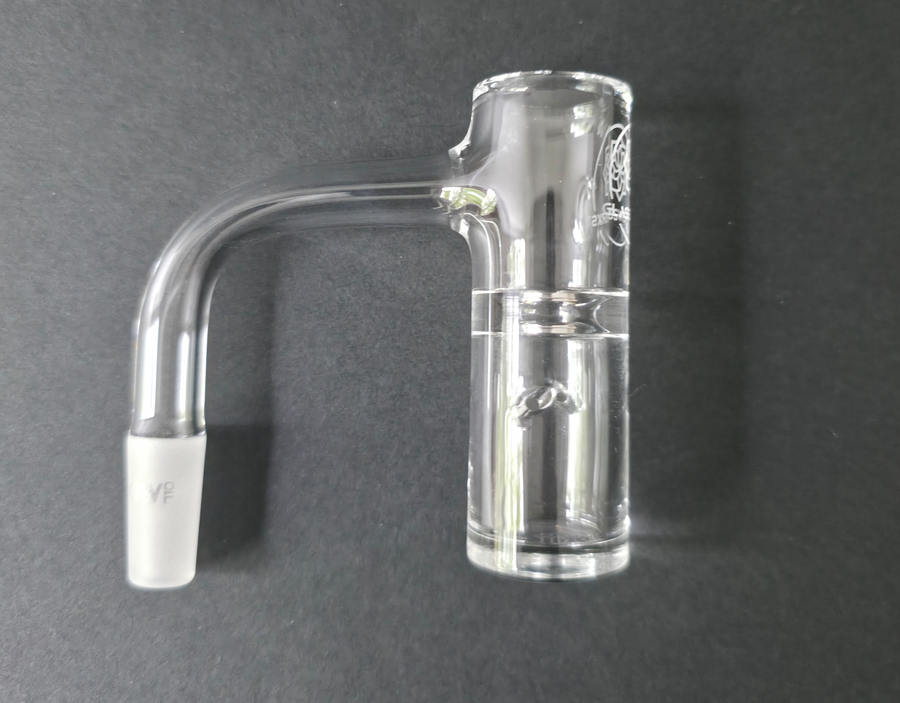 Clear glass quartz banger on a dark grey background