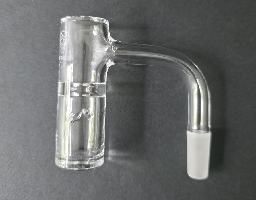 Clear glass quartz banger on a dark grey background