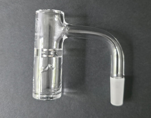 Clear glass quartz banger on a dark grey background