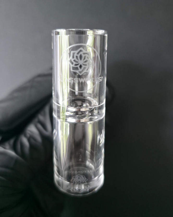 Clear glass quartz banger on a dark grey background