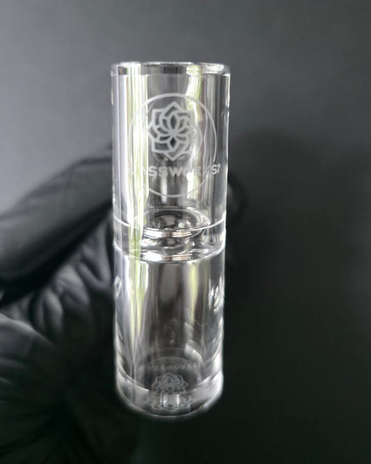 Clear glass quartz banger on a dark grey background
