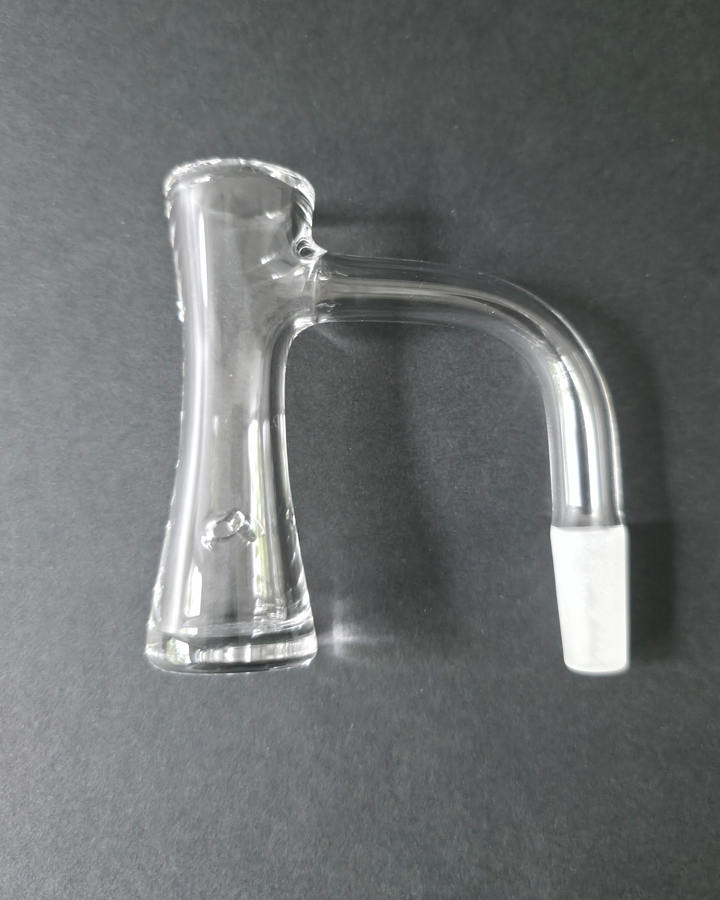 Clear Bronson glass quartz banger on a dark grey background