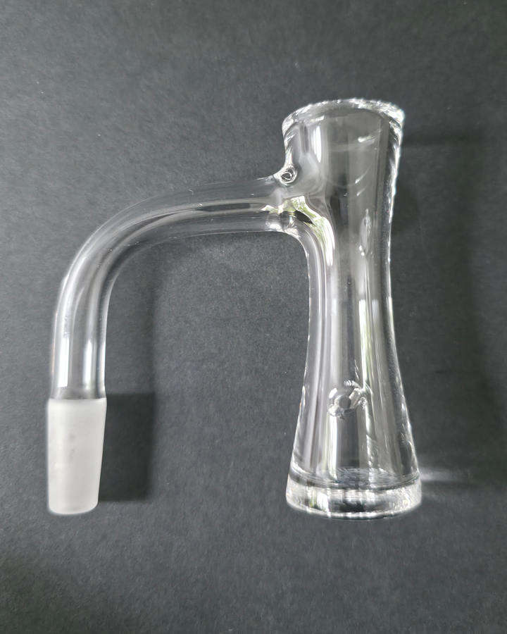Clear Bronson glass quartz banger on a dark grey background