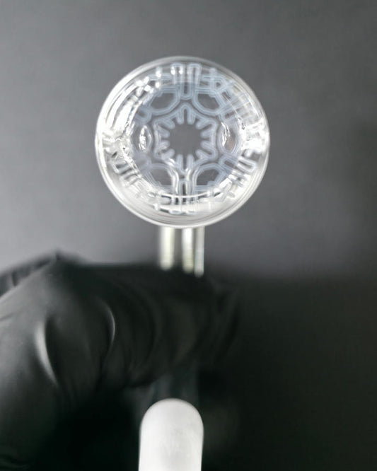 Clear Bronson glass quartz banger on a dark grey background