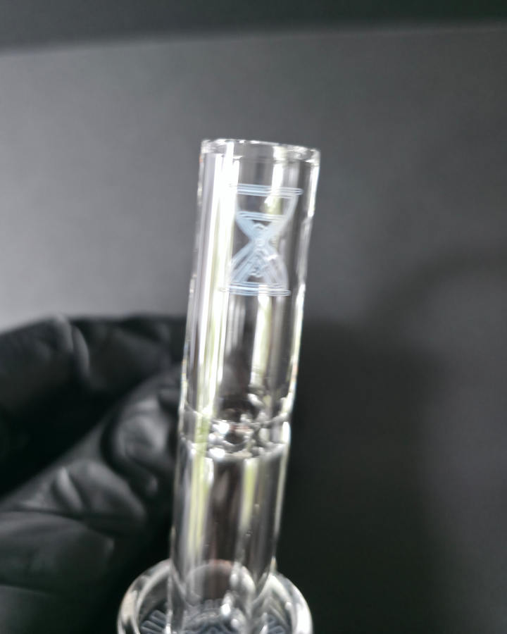 Clear glass quartz banger with threepeaksglassgallery logo on a dark grey background