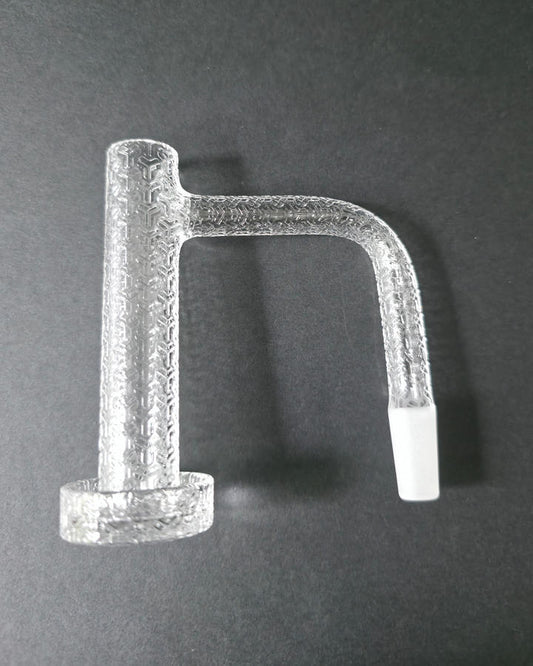 Clear glass quartz banger with embossed design on a dark grey background