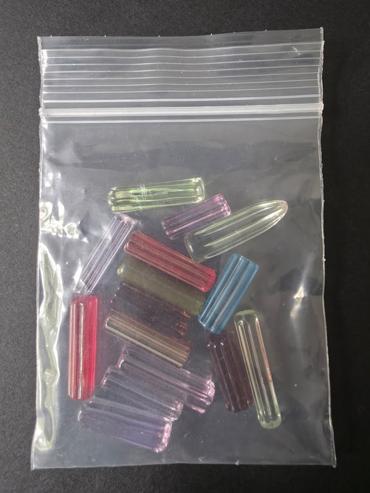  glass pearls used in bangers on a dark background