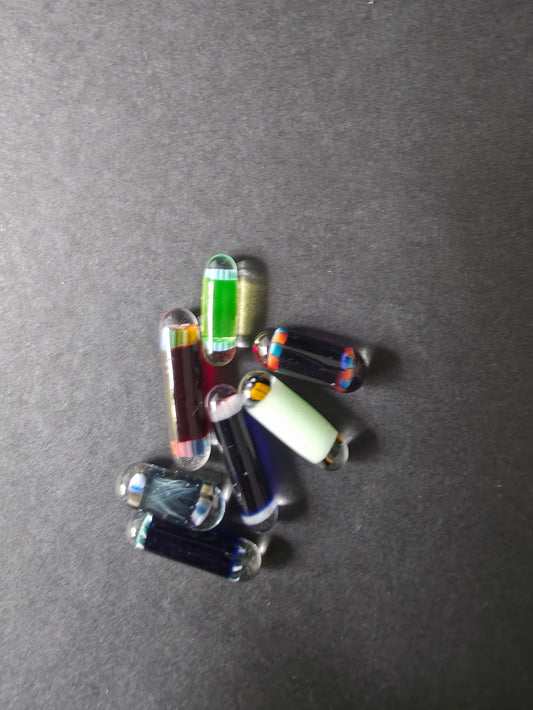  glass pearls used in bangers on a dark background