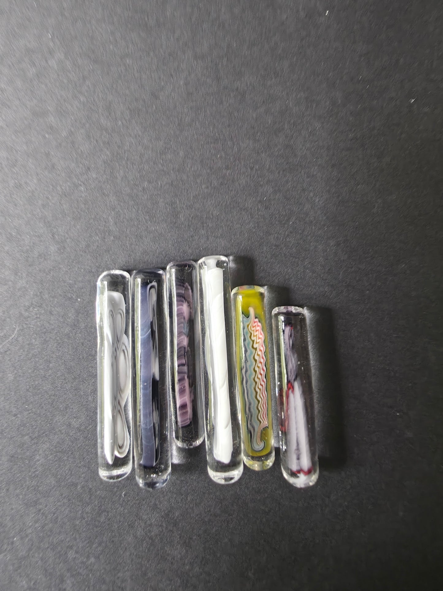  glass pearls used in bangers on a dark background