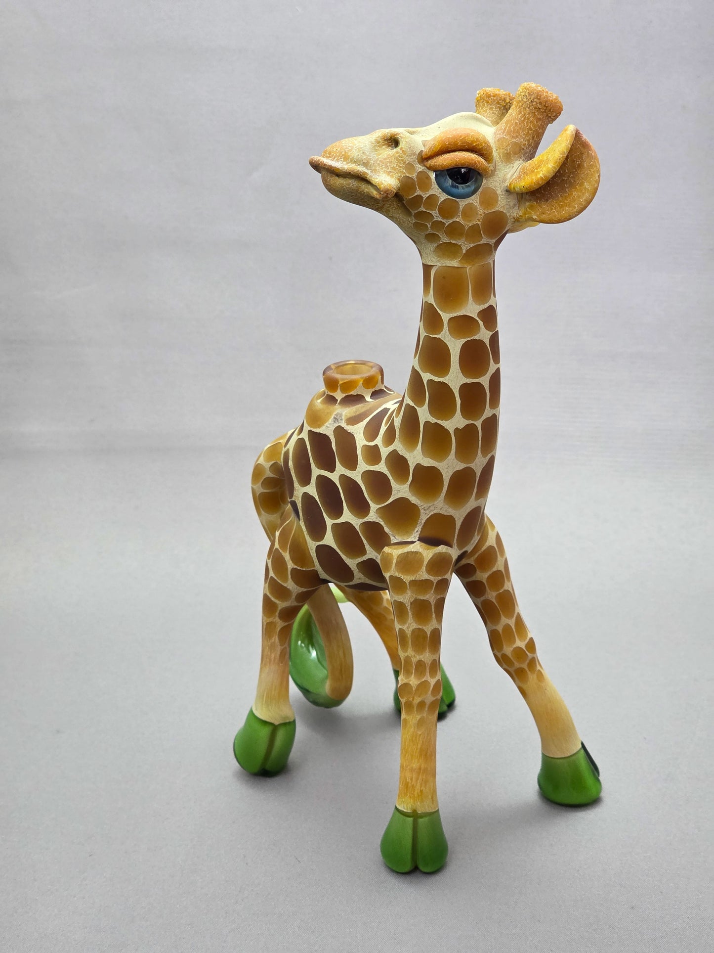 Robertson Glass Giraffe-shaped glass pipe on a light grey background