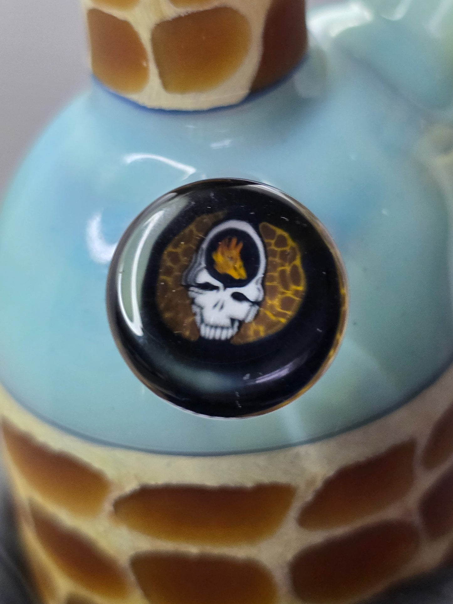 Robertson Glass blue giraffe pattern glass rig on a light grey background