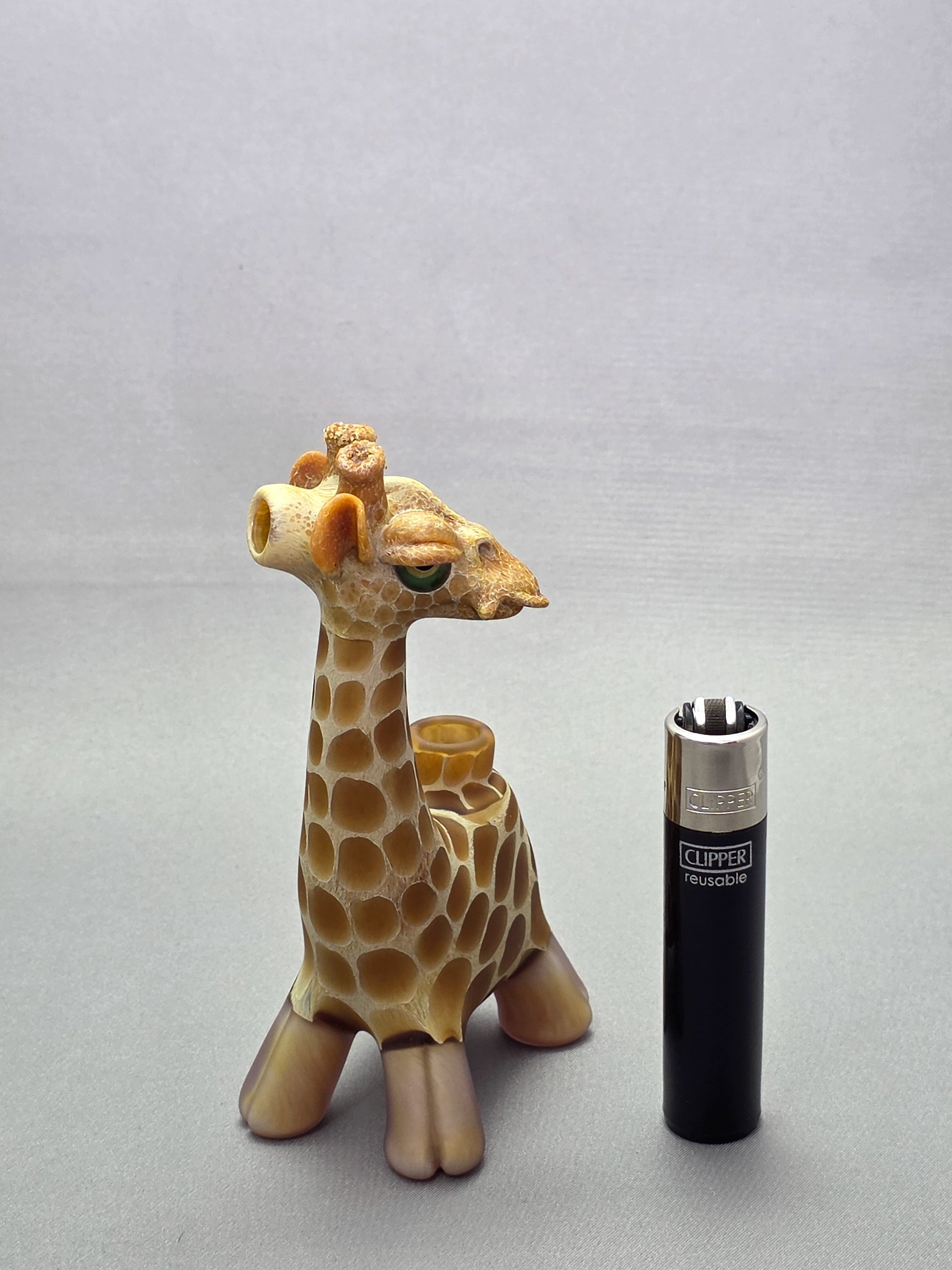Robertson Glass Giraffe-shaped glass pipe on a light grey background