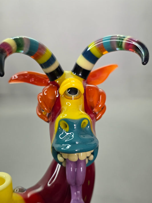 Robertson Glass Colourful glass Goat sculpture on a grey background