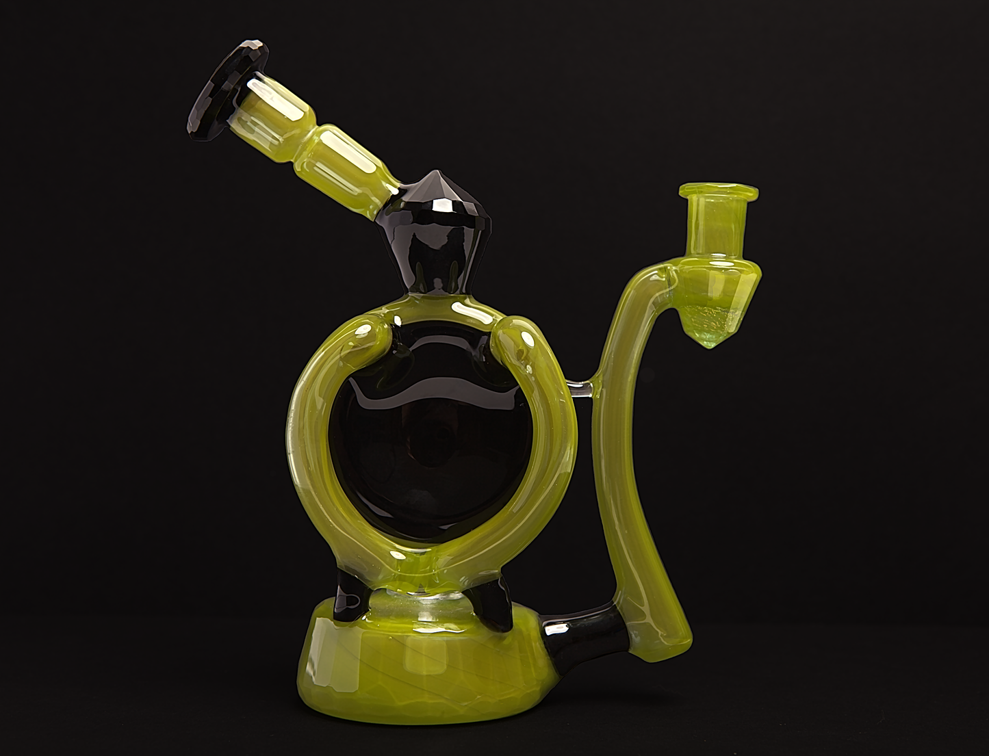 Mellow Glass Faceted Blooper Glass Rig smoking device with a black and green colour scheme on a black background