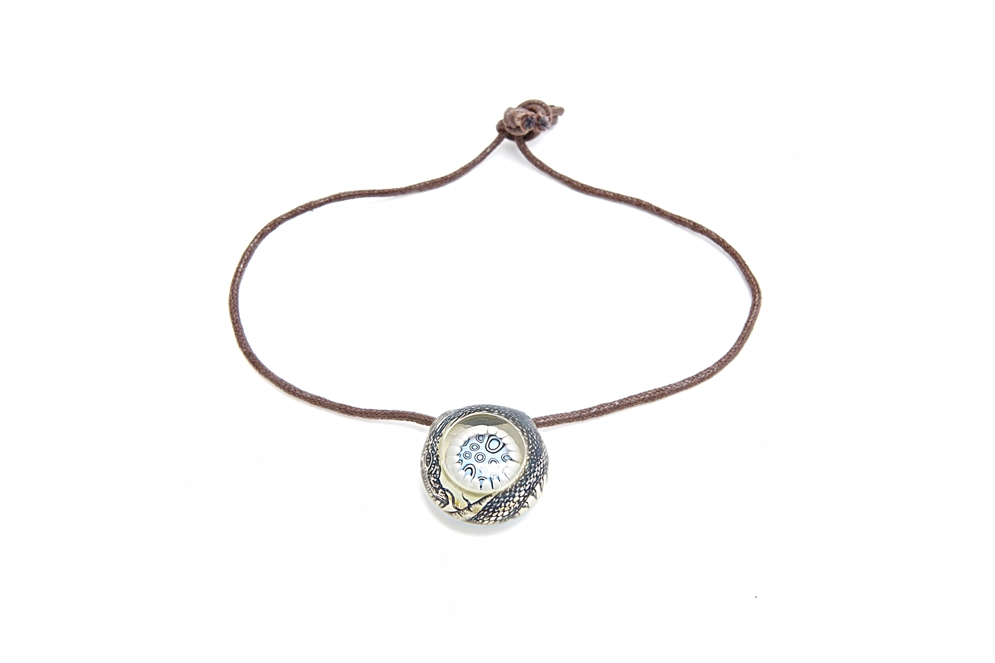 Bracelet with a circular pendant featuring a blue gemstone on a white background
