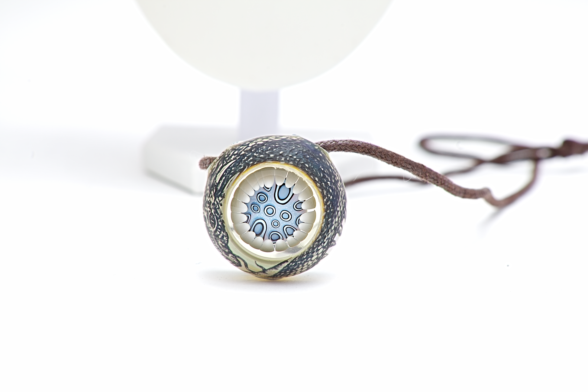 Necklace with a decorative pendant on a white background