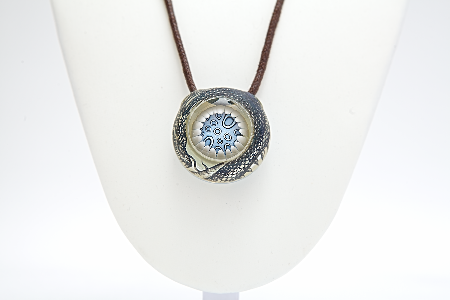 Necklace with a round pendant on a white background