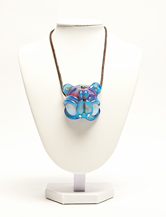 Colorful glass pendant on a white stand with a white background