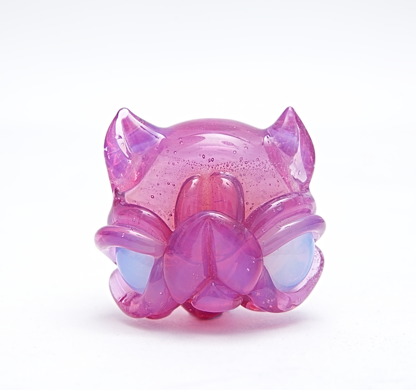 Pink and purple cat-shaped  pendant on a white background